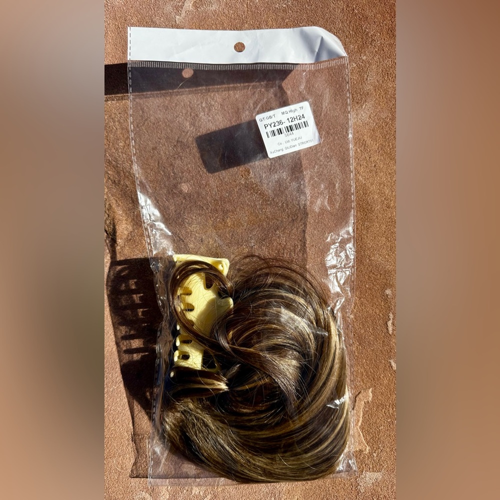 New synthetic hairpiece claw clip attachment. Lt. brown/golden blonde highlights